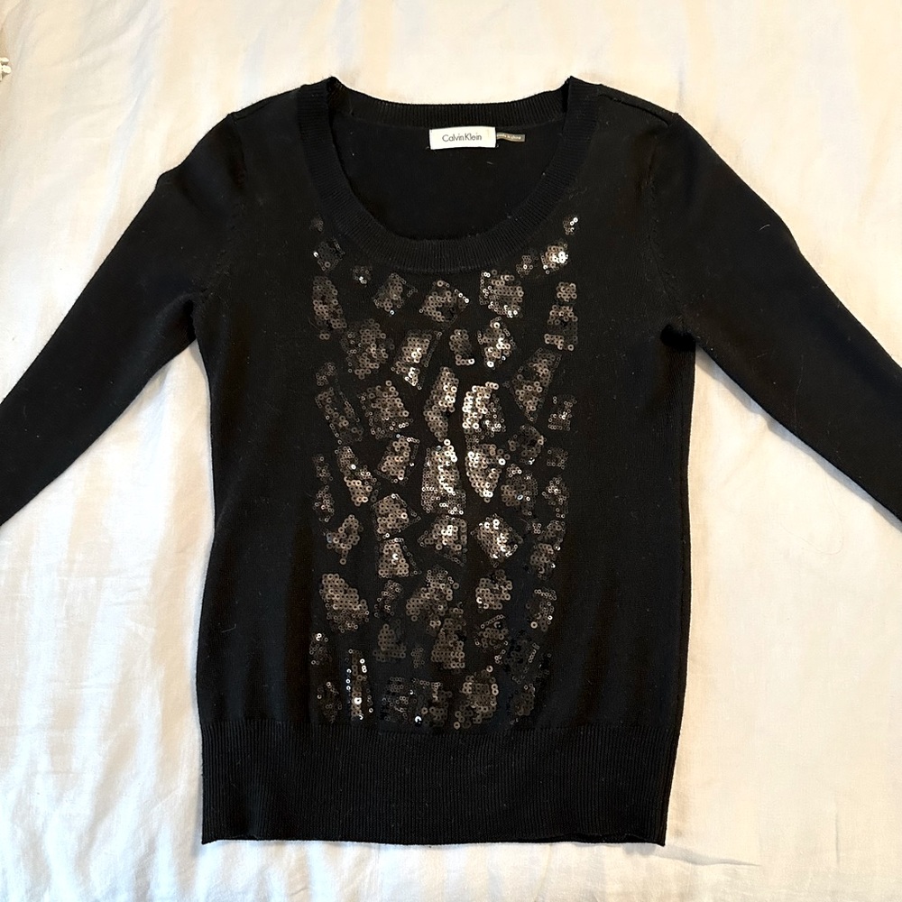Black long sleeve Calvin Klein fitted sweater.  In great condition.